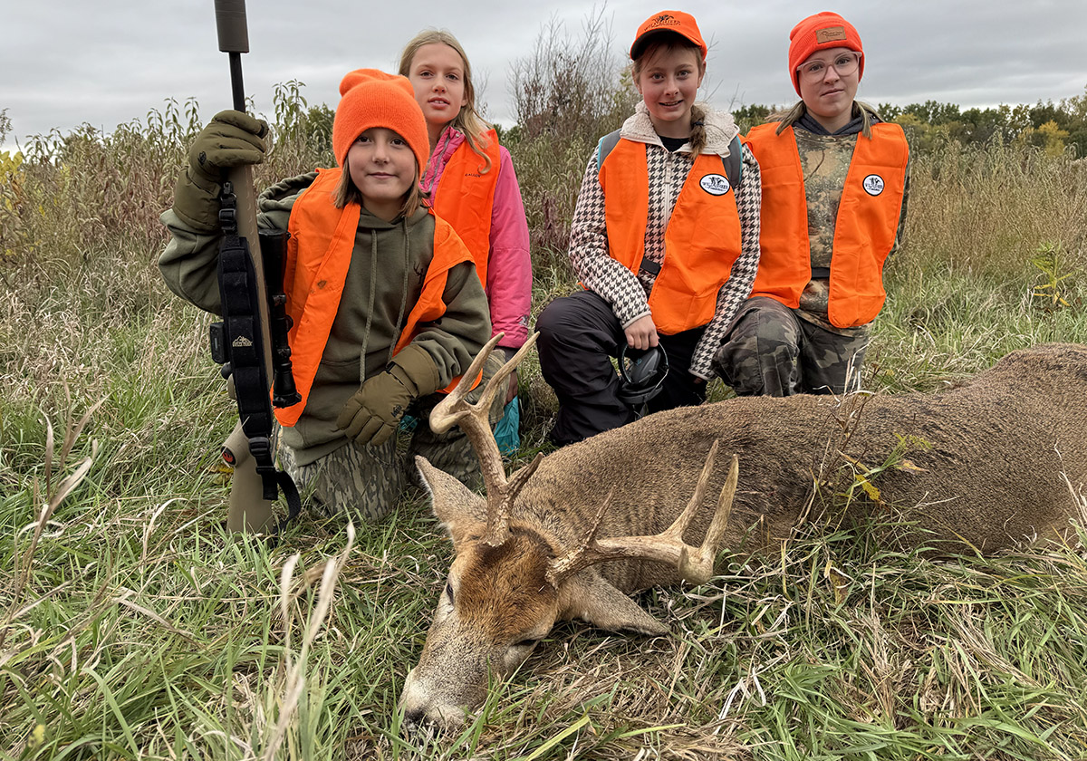 four youth hunters with a first deer four youth hunters with a first deer